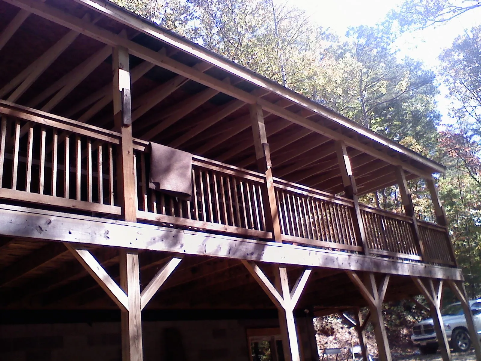 Timber framing under a new elevated porch and deck — Roof Leak Repair in Southold by Roofing Brothers